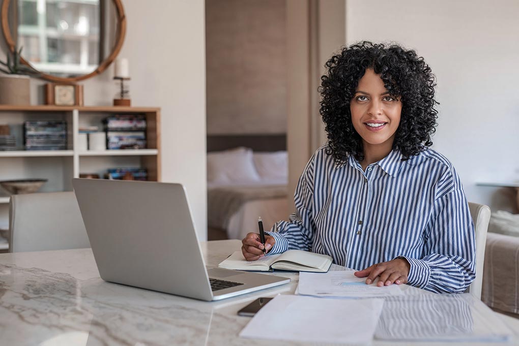 Woman working at a computer.